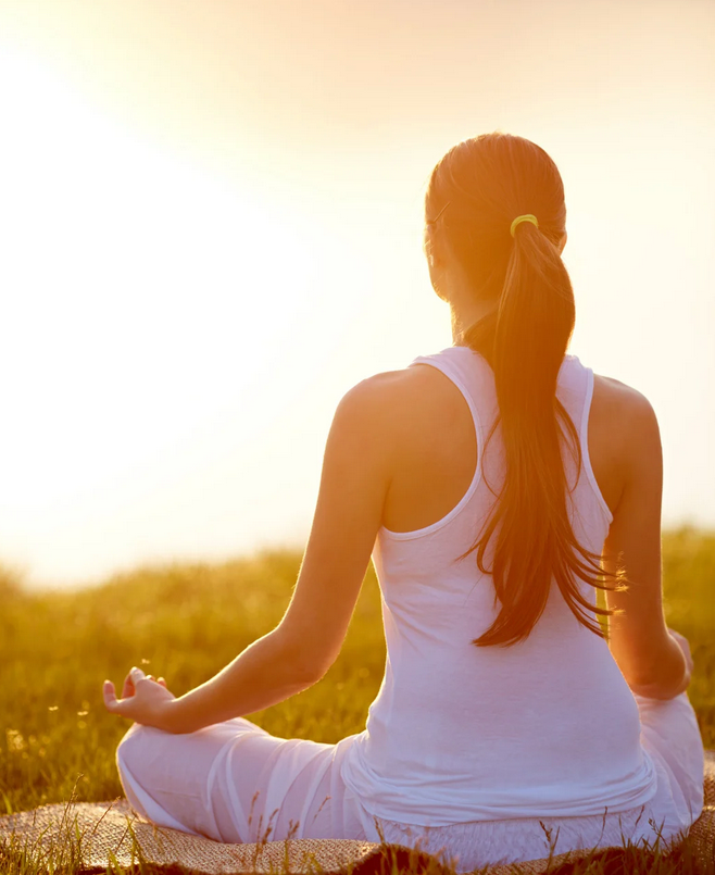 Woman practicing meditation outdoors at California Detox & Recovery Center to support mindfulness and healing during addiction recovery.