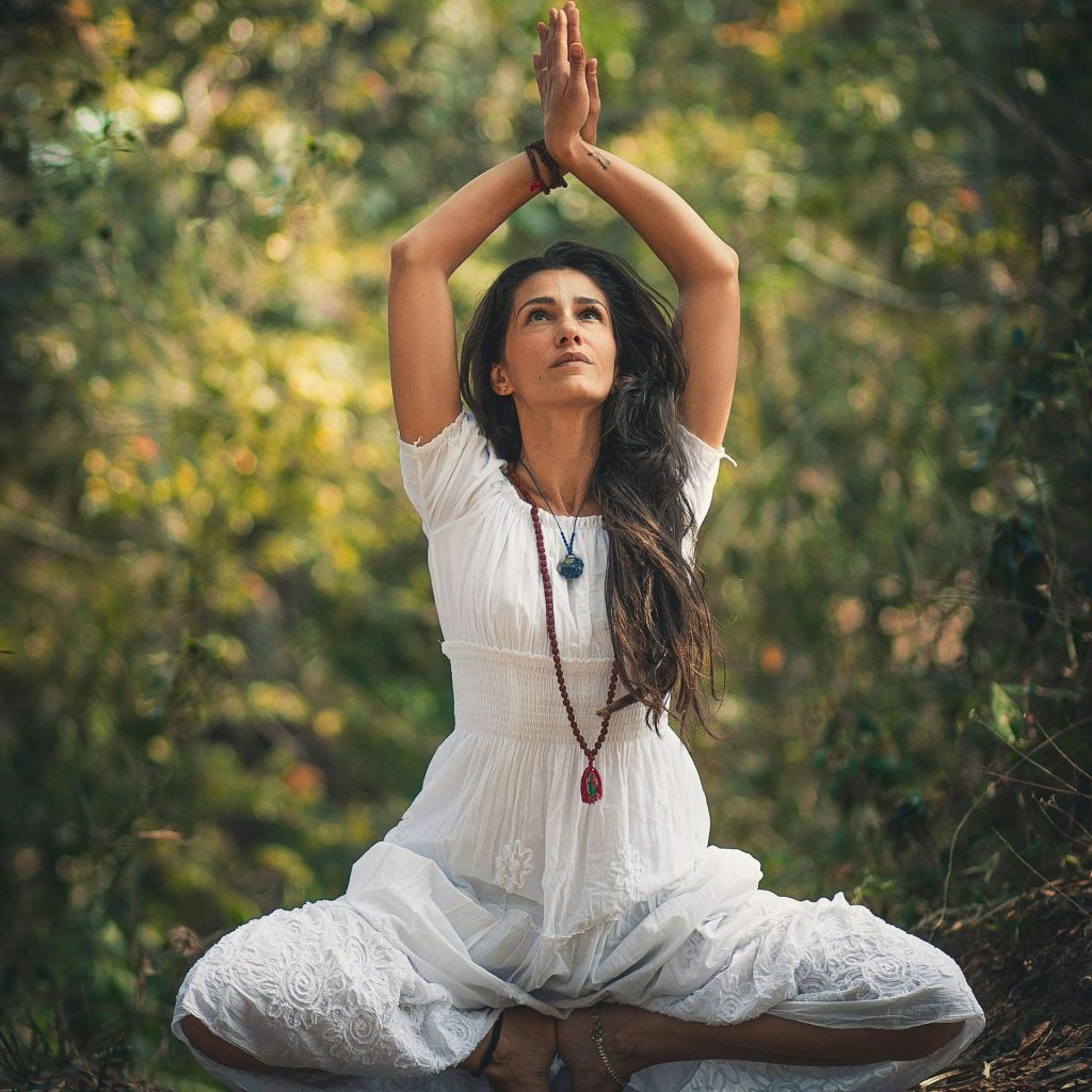 Woman practicing yoga meditation outdoors at California Detox & Recovery Center to support healing, mindfulness, and addiction recovery.