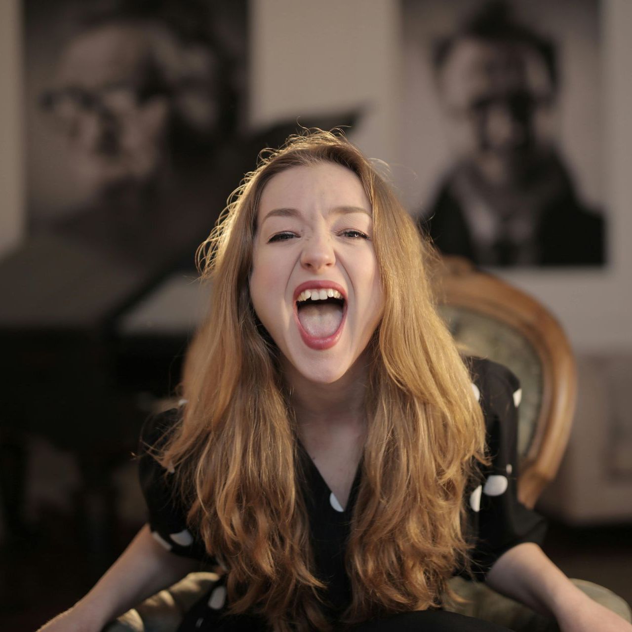 Woman expressing emotions during therapy session at California Detox & Recovery Center, highlighting emotional release in addiction recovery.