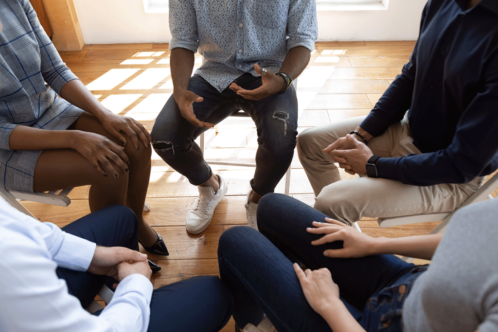 Support group in discussion at California Detox & Recovery Center, highlighting the role of 12-step programs in alcohol addiction treatment in Los Angeles.