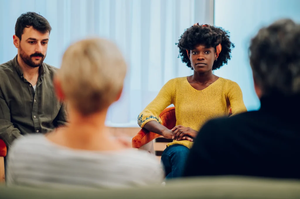 Woman participating in group therapy for mental health and addiction treatment at California Detox & Recovery Center in Los Angeles.