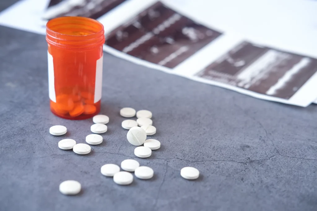 Prescription pills spilling from a bottle, representing substance abuse treatment at California Detox & Recovery Center in Los Angeles.