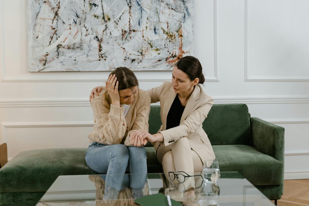 Female therapist comforting her patient as she opens up during an individual therapy session at California Detox & Recovery Center in Los Angeles.