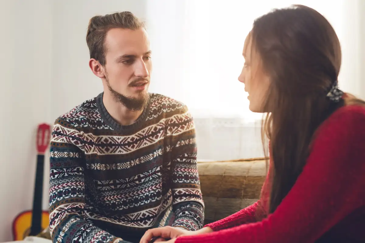 Couple talking seriously at home
