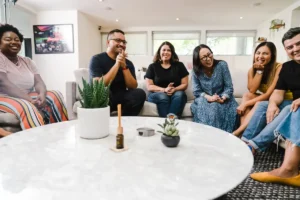 Diverse Group of People Gathered in the Living Room