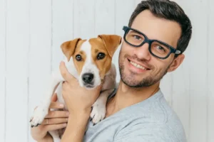Man Carrying Pet Dog
