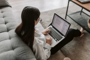 Woman Working at addiction treatment center Using Her Laptop