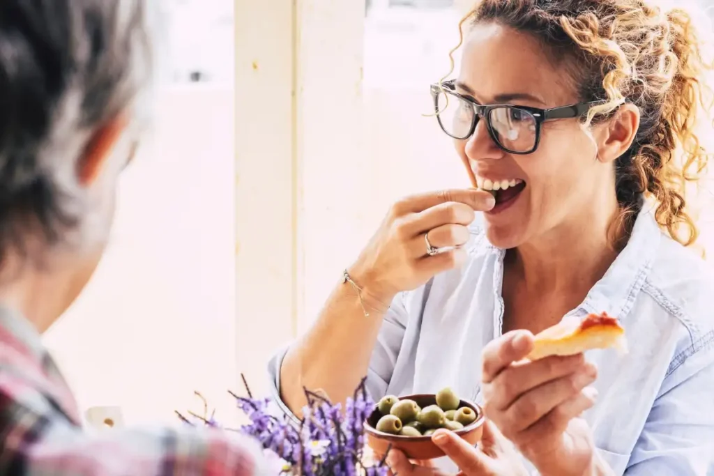Group Of People Eating Mediterranean Food