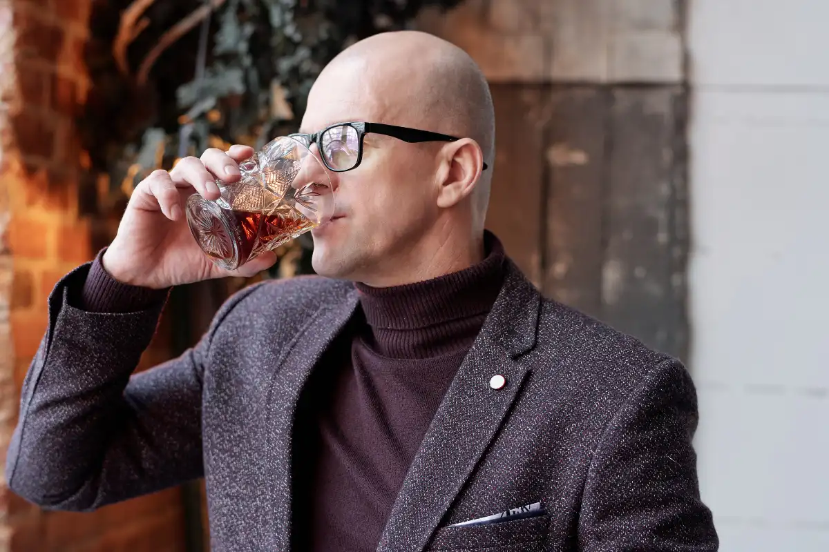 man drinking alcohol